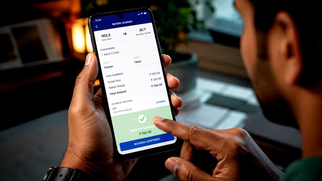 Person making quick online payment for railway ticket using smartphone